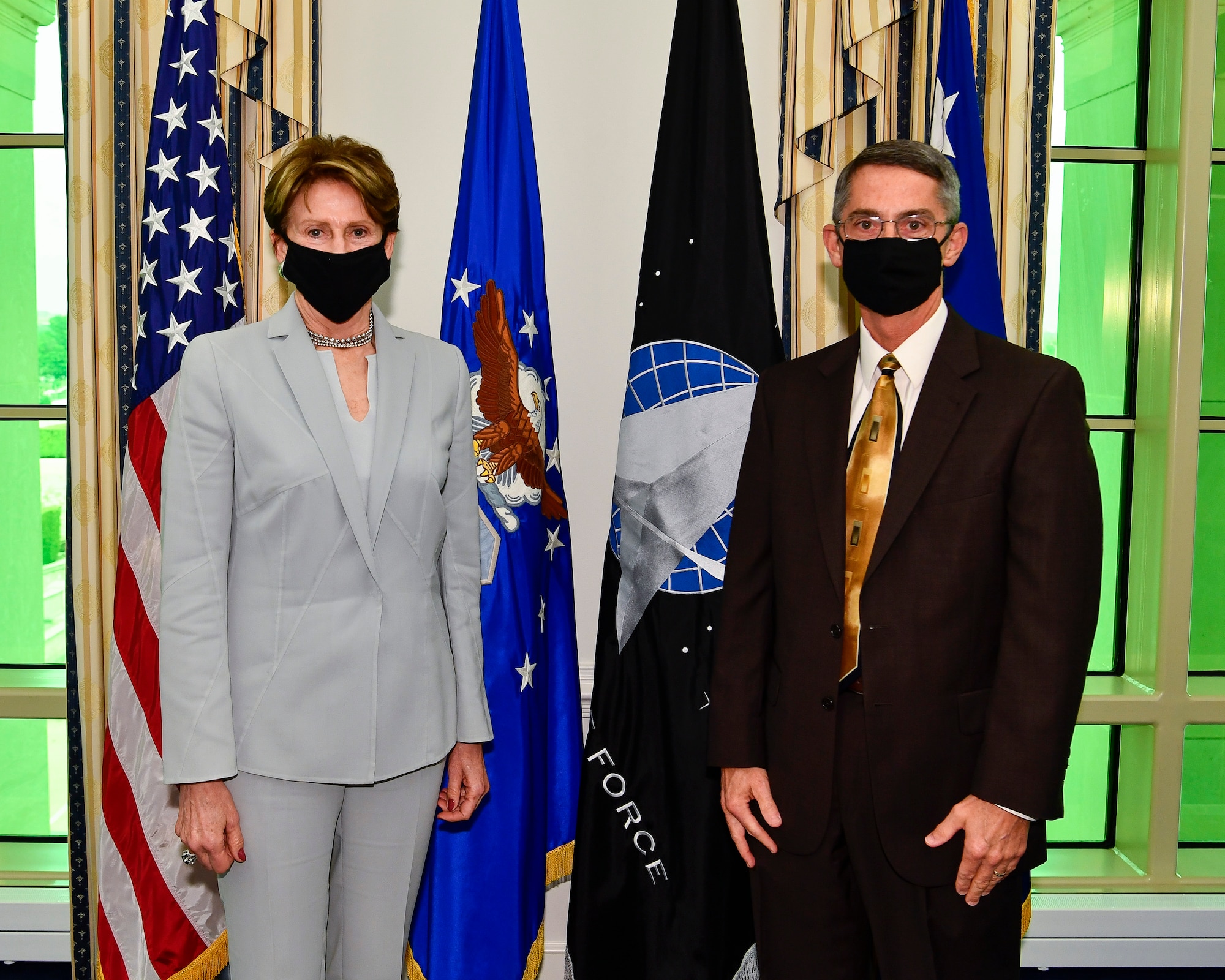 Secretary of the Air Force Barbara M. Barrett recognizes staff member Tim Tippett.
