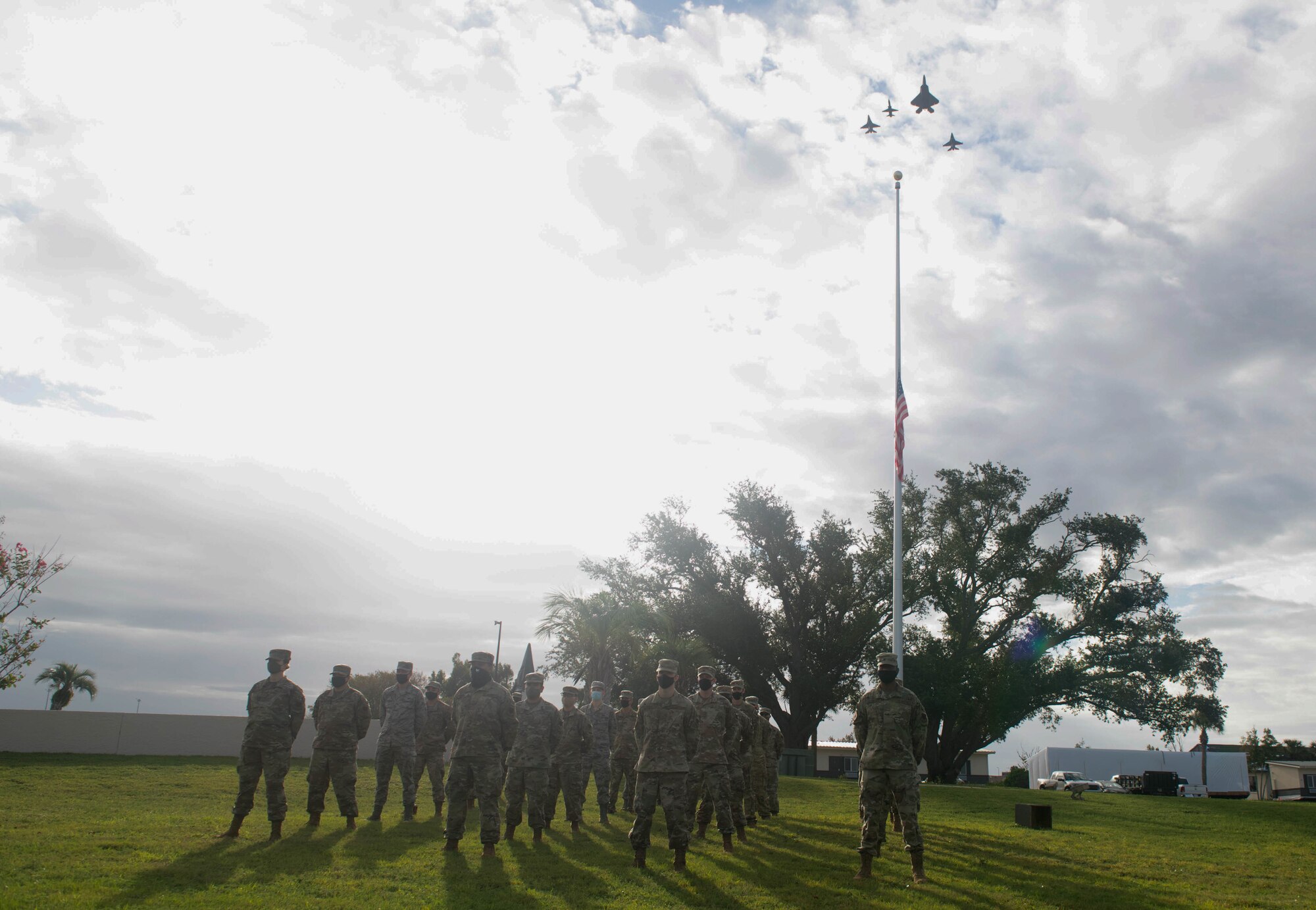 U.S. Airmen with the 81st Air Control Squadron stand in formation at Flag Park at Tyndall Air Force Base, Florida, Sept. 24, 2020. The 43rd Fighter Squadron lead the team Tyndall flyover in support of the POW/MIA vigil run coordinated by the 81st ACS. (U.S. Air Force photo by Airman Anabel Del Valle)