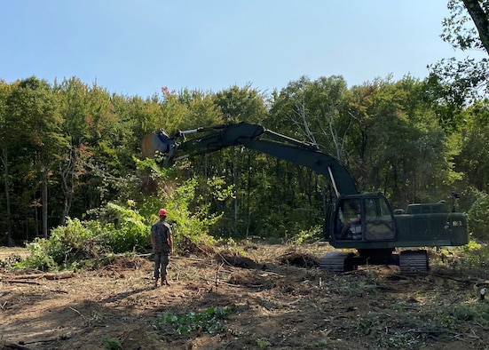 U.S. Marines from Marine Wing Support Squadron 472, Detachment B use an excavator to remove trees and brush during renovations to the explosive ordinance disposal range Sept. 21, 2020 on Westover Air Reserve Base, Massachusetts. Improvements to the EOD range include a new road and reinforced connex viewing bunker. (U.S. Air Force photo by Maj. Meghan Smith)