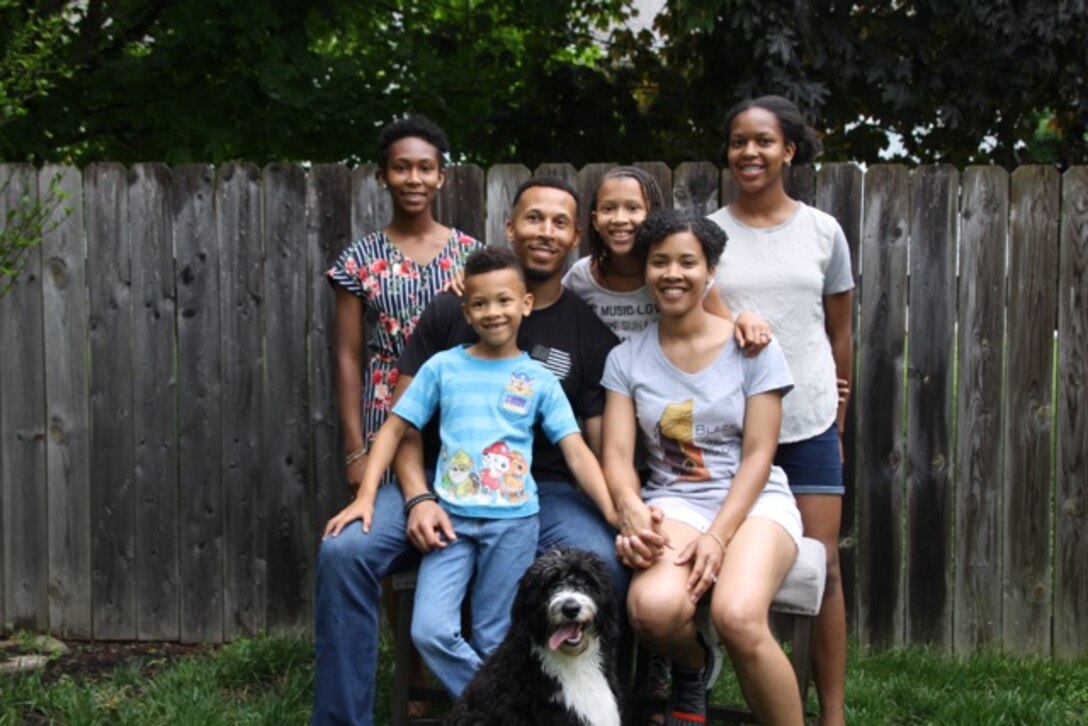 Maj. Jazmyn Hyman relaxes at home with her family in Dayton, Ohio.