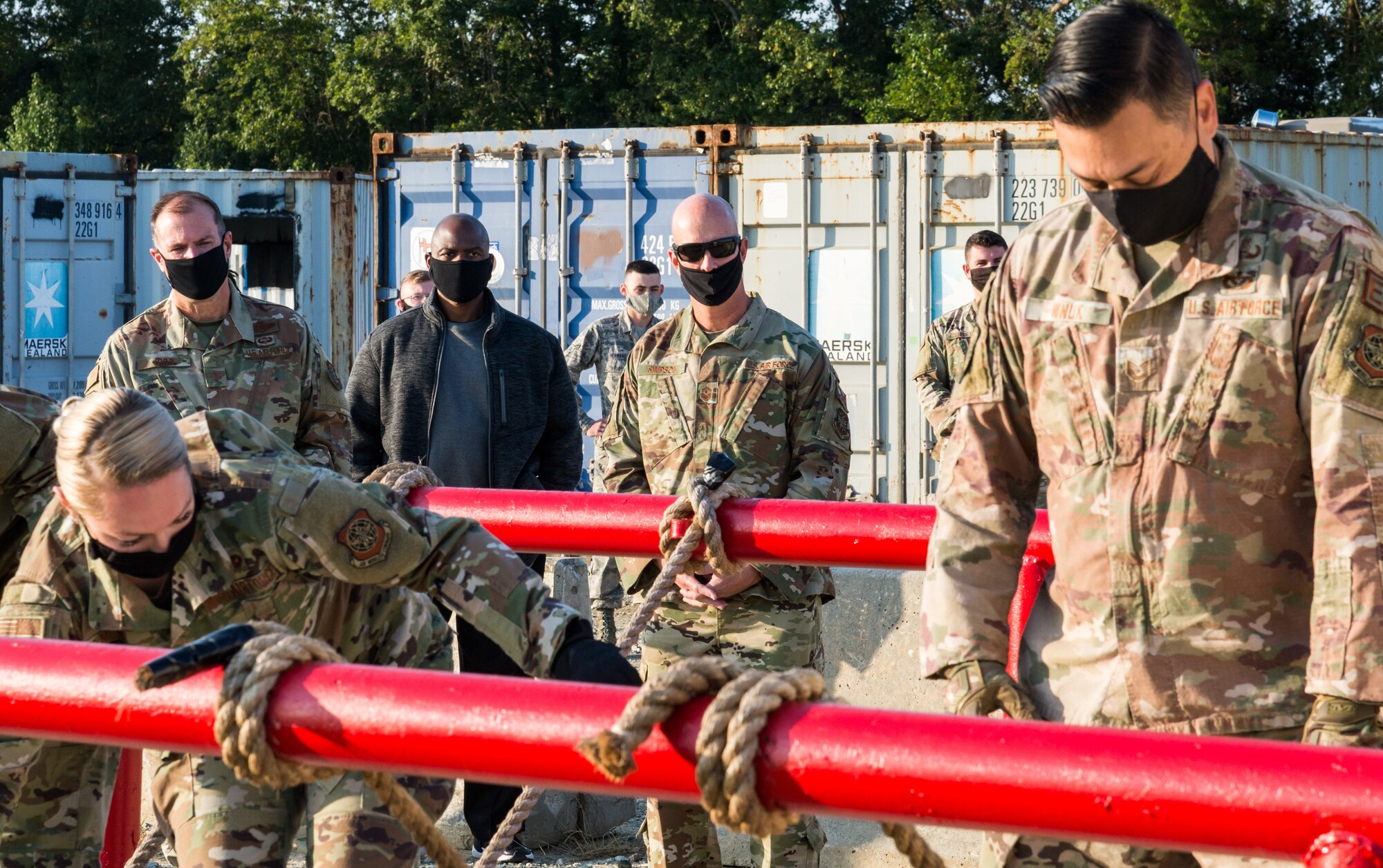 Maj. Gen. Thad Bibb, 18th Air Force commander, and Chief Master Sgt. Chris Simpson, 18th Air Force command chief, watch a demonstration by Tactics and Leadership Nexus cadre Sept. 23, 2020, at Dover Air Force Base, Delaware. Bibb, who previously served as the commander of the 9th Airlift Squadron, returned to Dover AFB after 10 years to learn about how Dover Airmen contribute to the 18th Air Force mission of warfighter readiness and sustainment. He and Simpson experienced firsthand Dover AFB’s diverse missions and toured its new facilities, including TALN and Bedrock: the base’s innovation lab. (U.S. Air Force photo by Roland Balik)
