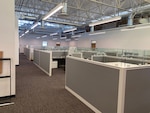 Renovated office space with new cubicles pictured.
