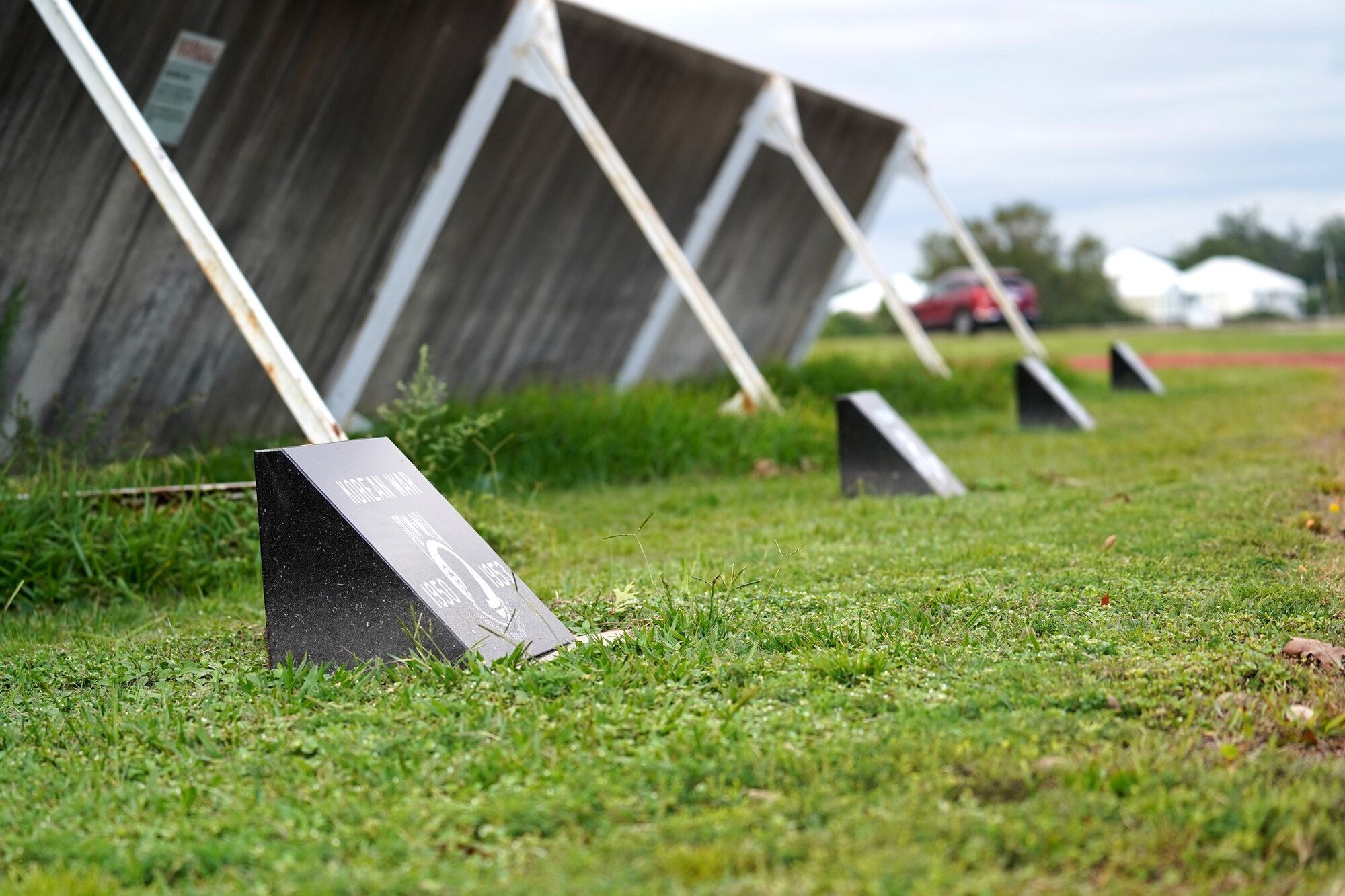 POW/MIA plaques are displayed on Ploesti Drive at Keesler Air Force Base, Mississippi, Sept. 24, 2020. The plaques were placed along the road to raise awareness and pay tribute to all prisoners of war and the military members still missing in action. (U.S. Air Force photo by Airman 1st Class Seth Haddix)