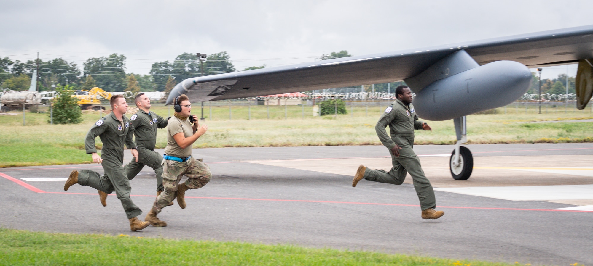 Barksdale Airmen run to a B-52H Stratofortress during a readiness exercise at Barksdale Air Force Base, La., Sept. 25, 2020.