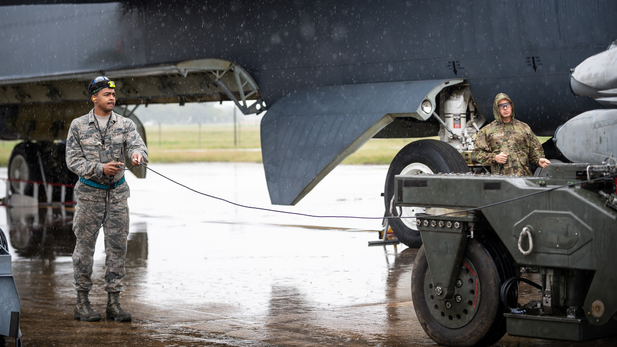 Senior Airman Timothy Pierce and Senior Airman Paul Donahue, 20th Aircraft Maintenance Unit weapons load crew members, load munitions on a B-52H Stratofortress during a readiness exercise at Barksdale Air Force Base, La., Sept. 21, 2020.