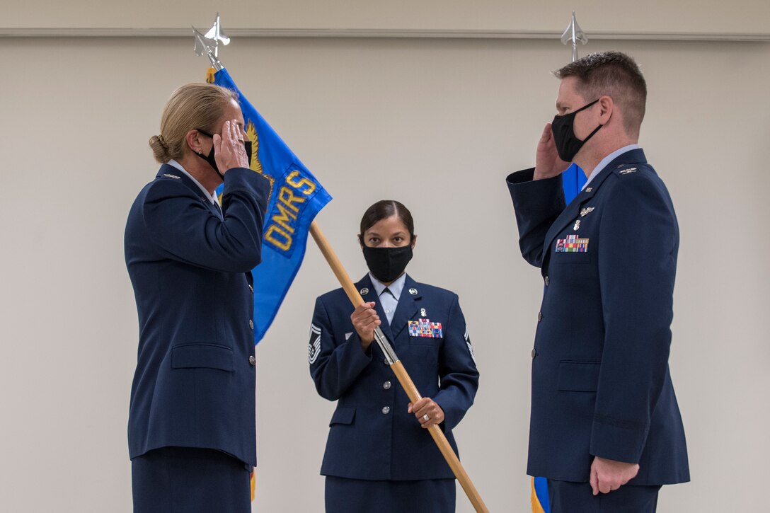 Airmen salute each other