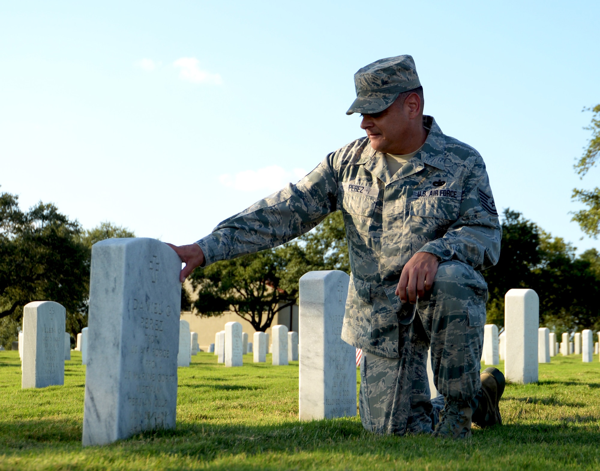 Tech. Sgt. Joseph Perez, 26th Aerial Port Squadron ramp services supervisor, visits the grave of his father Sept. 25, 2020, at Fort Sam Houston Cemetery, San Antonio, Texas. (U.S. Air Force photo by Tech. Sgt. Samantha Mathison)