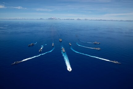 PHILIPPINE SEA (Sept. 25, 2020) From left, USNS Charles Drew (T-AKE 10), USS Comstock (LSD 45), USS Shiloh (CG 67), USS New Orleans (LPD 18), USS Chicago (SSN 721), USS America (LHA 6), USS Ronald Reagan (CVN 76), USNS John Ericsson (T-AO 194), USS Antietam (CG 54), USS Germantown (LSD 42), and USNS Sacagawea (T-AKE 2) break away from formation in support of Valiant Shield 2020. Valiant Shield is a U.S. only, biennial field training exercise (FTX) with a focus on integration of joint training in a blue-water environment among U.S. forces. This training enables real-world proficiency in sustaining joint forces through detecting, locating, tracking and engaging units at sea, in the air, on land and in cyberspace in response to a range of mission areas. (U.S. Navy photo by Mass Communication Specialist 3rd Class Jason Tarleton)