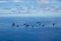 PHILIPPINE SEA (Sept. 25, 2020) From left, USNS Charles Drew (T-AKE 10), USS Comstock (LSD 45), USS Shiloh (CG 67), USS New Orleans (LPD 18), USS Chicago (SSN 721), USS America (LHA 6), USS Ronald Reagan (CVN 76), USNS John Ericsson (T-AO 194), USS Antietam (CG 54), USS Germantown (LSD 42), and USNS Sacagawea (T-AKE 2) steam in formation in support of Valiant Shield 2020. Valiant Shield is a U.S. only, biennial field training exercise (FTX) with a focus on integration of joint training in a blue-water environment among U.S. forces. This training enables real-world proficiency in sustaining joint forces through detecting, locating, tracking and engaging units at sea, in the air, on land and in cyberspace in response to a range of mission areas. (U.S. Navy photo by Mass Communication Specialist 3rd Class Jason Tarleton)
