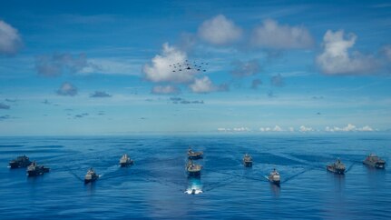 PHILIPPINE SEA (Sept. 25, 2020) From left, USNS Charles Drew (T-AKE 10), USS Comstock (LSD 45), USS Shiloh (CG 67), USS New Orleans (LPD 18), USS Chicago (SSN 721), USS America (LHA 6), USS Ronald Reagan (CVN 76), USNS John Ericsson (T-AO 194), USS Antietam (CG 54), USS Germantown (LSD 42), and USNS Sacagawea (T-AKE 2) steam in formation in support of Valiant Shield 2020. Valiant Shield is a U.S. only, biennial field training exercise (FTX) with a focus on integration of joint training in a blue-water environment among U.S. forces. This training enables real-world proficiency in sustaining joint forces through detecting, locating, tracking and engaging units at sea, in the air, on land and in cyberspace in response to a range of mission areas. (U.S. Navy photo by Mass Communication Specialist 2nd Class Codie Soule)