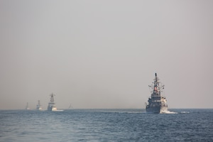 Navy coastal patrol ships and Coast Guard patrol boats, attached to Task Force (TF) 55, sail in formation during the joint air operations in support of maritime surface warfare (AOMSW) exercise in the Arabian Gulf, Sept. 24. Combined integration operations between joint U.S. forces are regularly held to maintain interoperability and the capability to counter threats posed in the maritime domain, ensuring freedom of navigation and free flow of commerce throughout the region's heavily trafficked waterways. (U.S. Army photo by Spc. Joshua DuRant)
