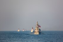 Navy coastal patrol ships and Coast Guard patrol boats, attached to Task Force (TF) 55, sail in formation during the joint air operations in support of maritime surface warfare (AOMSW) exercise in the Arabian Gulf, Sept. 24. Combined integration operations between joint U.S. forces are regularly held to maintain interoperability and the capability to counter threats posed in the maritime domain, ensuring freedom of navigation and free flow of commerce throughout the region's heavily trafficked waterways. (U.S. Army photo by Spc. Joshua DuRant)