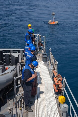 Sailors assigned to the Navy coastal patrol ship USS Whirlwind (PC 11) set up a target for an aerial gunnery drill during the joint air operations in support of maritime surface warfare (AOMSW) exercise in the Arabian Gulf, Sept. 24. Combined integration operations between joint U.S. forces are regularly held to maintain interoperability and the capability to counter threats posed in the maritime domain, ensuring freedom of navigation and free flow of commerce throughout the region's heavily trafficked waterways.