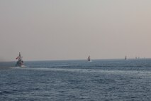 Navy coastal patrol ships and Coast Guard patrol boats, attached to Task Force (TF) 55, sail in formation during the joint air operations in support of maritime surface warfare (AOMSW) exercise in the Arabian Gulf, Sept. 24. Combined integration operations between joint U.S. forces are regularly held to maintain interoperability and the capability to counter threats posed in the maritime domain, ensuring freedom of navigation and free flow of commerce throughout the region's heavily trafficked waterways. (U.S Army photo by Spc. William Gore)