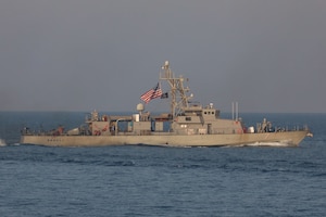 Navy coastal patrol ship USS Squall (PC 7), attached to Task Force (TF) 55, sails in the Arabian Gulf during the joint air operations in support of maritime surface warfare (AOMSW) exercise, Sept. 24. Combined integration operations between joint U.S. forces are regularly held to maintain interoperability and the capability to counter threats posed in the maritime domain, ensuring freedom of navigation and free flow of commerce throughout the region's heavily trafficked waterways. (U.S Army photo by Spc. William Gore)