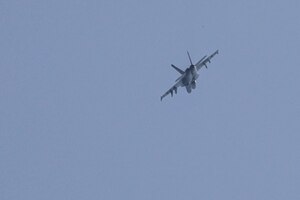 A Navy F/A-18F Super Hornet multi-role fighter jet, attached to the Nimitz Carrier Strike Group with embarked Carrier Air Wing 17, conducts flight operations during the joint air operations in support of maritime surface warfare (AOMSW) exercise in the Arabian Gulf, Sept. 24. Combined integration operations between joint U.S. forces are regularly held to maintain interoperability and the capability to counter threats posed in the maritime domain, ensuring freedom of navigation and free flow of commerce throughout the region's heavily trafficked waterways. (U.S Army photo by Spc. William Gore)