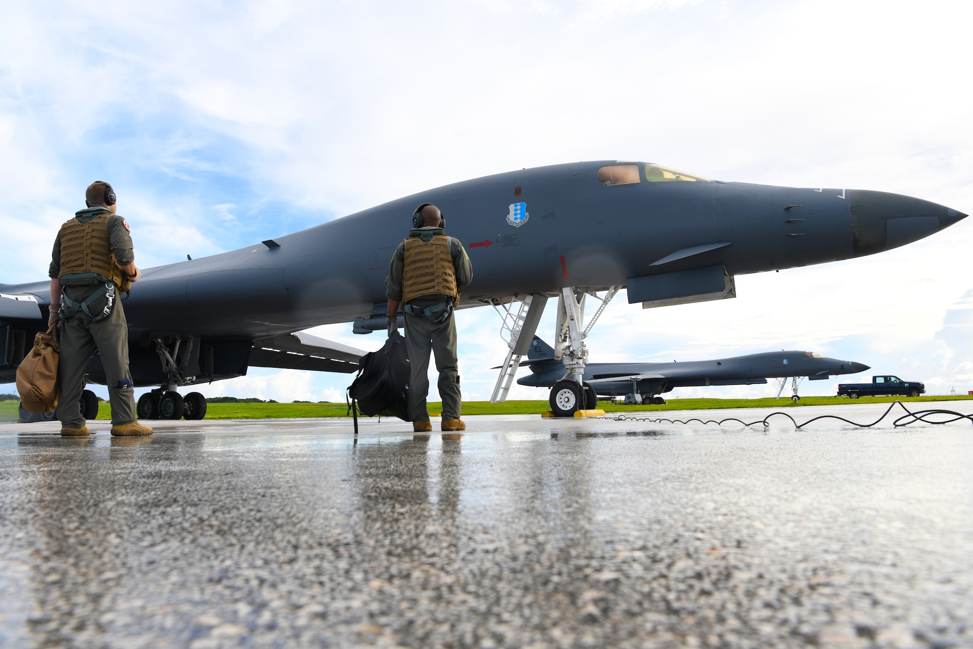 Aircrew assigned to the 34th Expeditionary Bomb Squadron, Ellsworth Air Force Base, S.D., prepare to board a B-1B Lancer in support of Exercise Valiant Shield at Andersen AFB, Guam, Sept. 18, 2020. The participating forces will exercise a wide range of capabilities and demonstrate the inherent flexibility of joint forces. The range of capabilities include maritime security operations, anti-submarine and air-defense exercises, amphibious operations, and other elements in complex warfighting. (U.S. Air Force photo by Staff Sgt. Nicolas Z. Erwin)