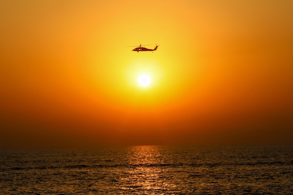 An MH-60R Seahawk helicopter conducts support to the joint air operations in support of maritime surface warfare (AOMSW) exercise in the Arabian Gulf, Sept. 24. Combined integration operations between joint U.S. forces are regularly held to maintain interoperability and the capability to counter threats posed in the maritime domain, ensuring freedom of navigation and free flow of commerce throughout the region's heavily trafficked waterways. (U.S Army photo by Spc. William Gore)