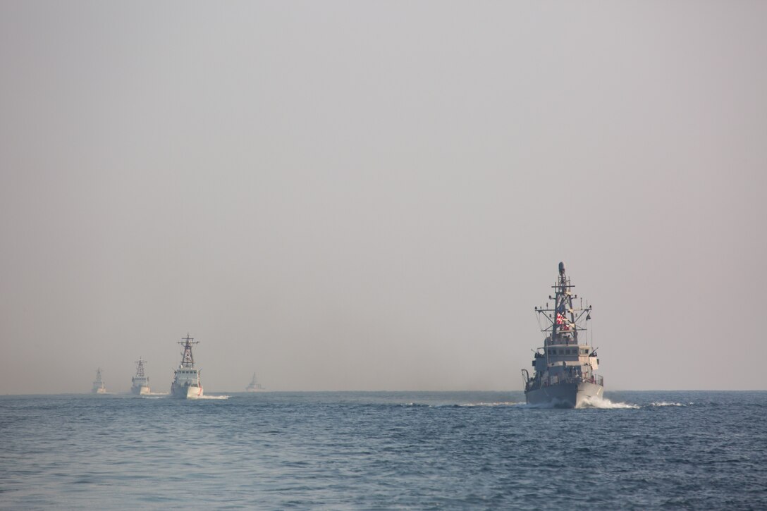 Navy coastal patrol ships and Coast Guard patrol boats, attached to Task Force (TF) 55, sail in formation during the joint air operations in support of maritime surface warfare (AOMSW) exercise in the Arabian Gulf, Sept. 24. Combined integration operations between joint U.S. forces are regularly held to maintain interoperability and the capability to counter threats posed in the maritime domain, ensuring freedom of navigation and free flow of commerce throughout the region's heavily trafficked waterways. (U.S. Army photo by Spc. Joshua DuRant)