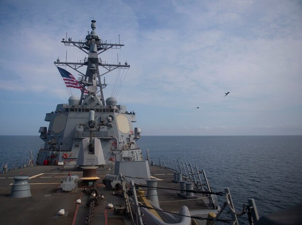 Two Royal Air Force Typhoon fighter jets execute a fly by exercise with the Arleigh Burke-class guided-missile destroyer USS Roosevelt (DDG 80), Sept. 25, 2020. Roosevelt, forward-deployed to Rota, Spain, is on its first patrol in the U.S. Sixth Fleet area of operations in support of regional allies and partners and U.S. national security interests in Europe and Africa.