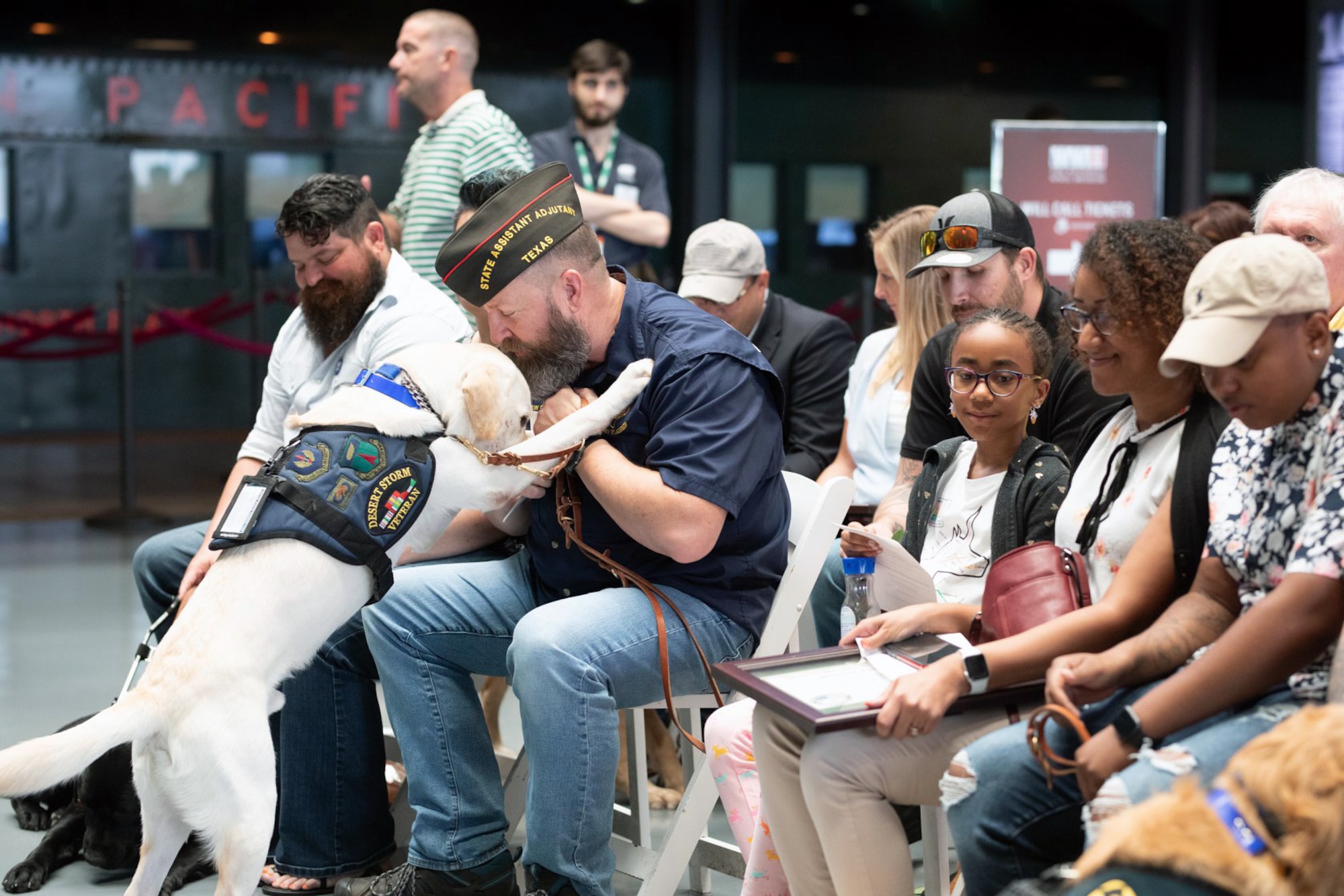Andrew Camplen, on his graduation day when he received Sebestian, his service dog at the National WWII Museum, New Orleans, LA, Aug. 24, 2019. “I was sitting in a chair waiting on my dog to be delivered. And I have to say that Monday, my heart was pounding, and the adrenaline rush, and then Sebastian was walked into the room by his trainer. Camplen is now the Director of Client Services for the United States Veterans Service Dogs, which was created for and dedicated to helping veterans return to a new “Normal” by training and placing quality service dogs with veterans.