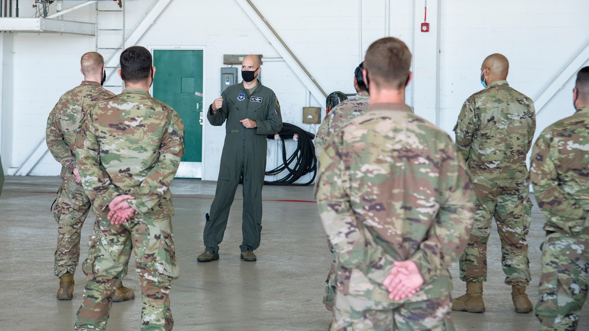 Col. Ryan Keeney, third from left, 49th Wing commander, speaks with Airmen from Holloman Air Force Base, New Mexico, during Exercise Agile Reaper, Sept. 23, 2020, at Naval Air Station Point Mugu, California. Approximately 40 Holloman Airmen participated in the routine training exercise to enhance their MQ-9 Reaper maritime domain mission set, while operating with total force members and joint partners. (U.S. Air Force photo by Senior Airman Collette Brooks)