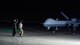 (From left to right) Col. Ryan Keeney, 49th Wing commander, assists in marshalling an MQ-9 Reaper with Senior Airman Christopher Cuevas, Senior Airman Christopher Cuevas, 9th Aircraft Maintenance Unit dedicated crew chief, during Exercise Agile Reaper, Sept. 24, 2020, at Naval Air Station Point Mugu, California. This training exercise focused on the rapid deployment of MQ-9 Reapers to a maritime location using minimal personnel, fuel and equipment in support of enhancing members’ abilities to operate the multi-role aircraft equipped to support forces in the high-end environment with persistent surveillance, reconnaissance and precision strike. (U.S. Air Force photo by Senior Airman Collette Brooks)