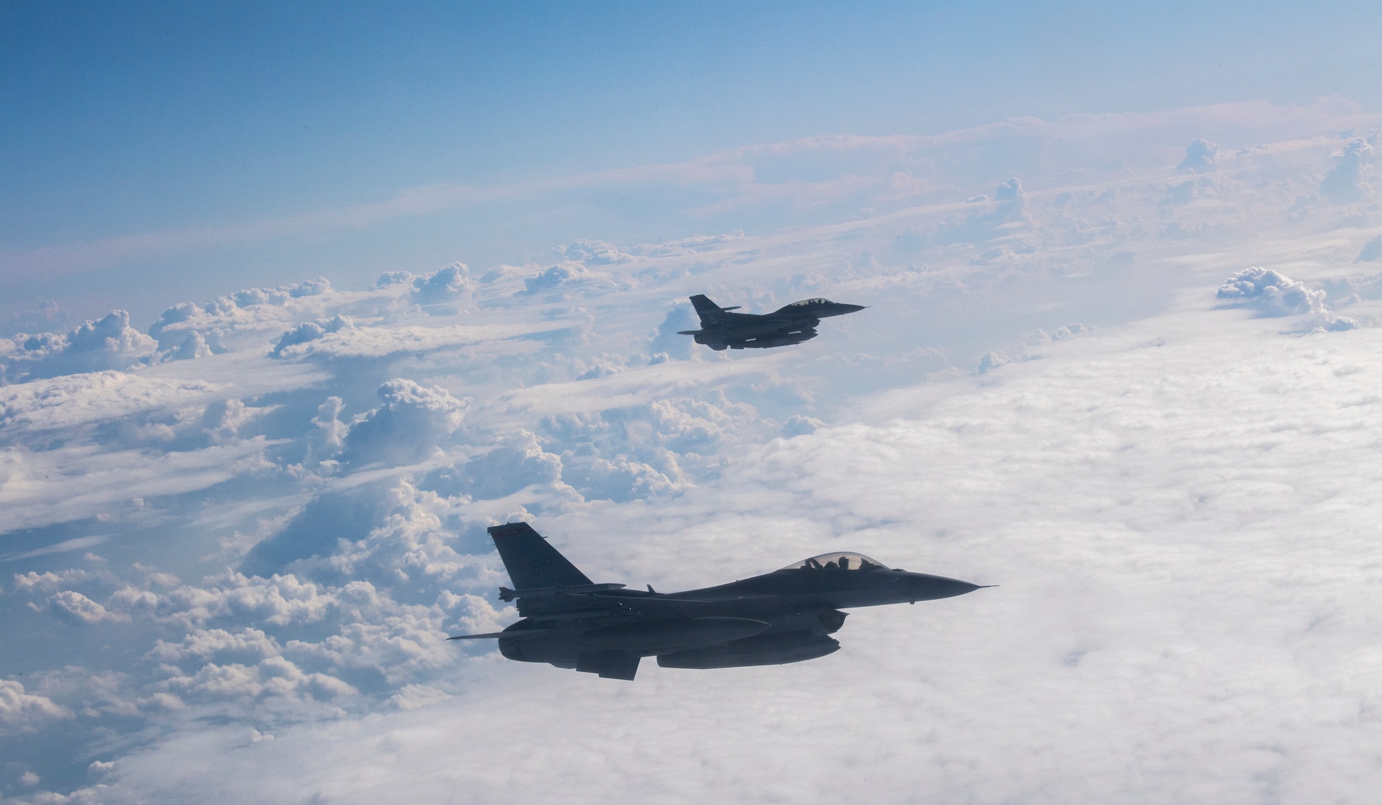 Two U.S. Air Force F-16 Fighting Falcons fly over Polish airspace during exercise Astral Knight, Sept. 24, 2020. Exercise participants included aircraft from U.S. and Polish forces, in which aircraft performed sorties that involved a combination of flight and computer-assisted scenarios during the exercise and utilized a surface-to-air missile system known as Patriot. (U.S. Air Force photo by Airman 1st Class Alison Stewart)