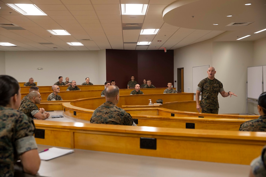 The 19th Sergeant Major of the Marine Corps, Sgt. Maj. Troy E. Black speaks to instructors at the Staff Non Commissioned Officer Academy at Marine Corps Base Camp Johnson, Jacksonville, N.C., Sept. 17, 2020. The visit allowed Sgt. Maj. Black to address Marines about leadership and the responsibilities and abilities of the SNCO rank. The College of Enlisted Military Education provides a continuum of education to improve leadership, sharpen critical and creative thinking skills, and deepen Marines' understanding of warfighting concepts in distributed and joint environments in order to foster ethical, professional leaders who make sound decisions in complex operational situations. (U.S. Marine Corps photo by Sgt. Victoria Ross)