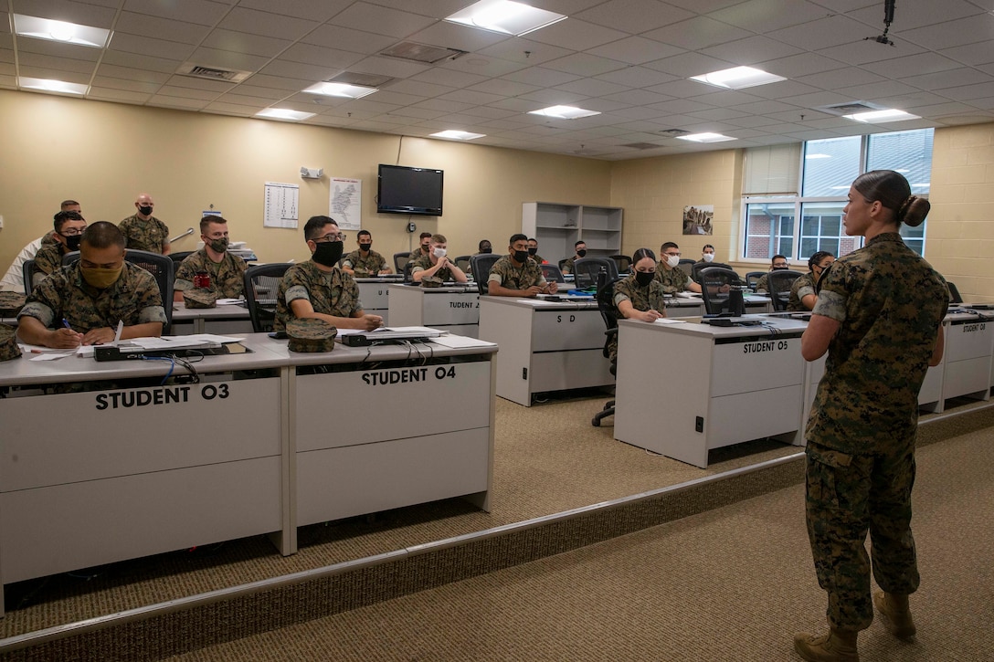 The 19th Sergeant Major of the Marine Corps, Sgt. Maj. Troy E. Black observes an entry level class at the Marine Corps Combat Service Support School (MCCSSS) at Marine Corps Base Camp Johnson, Jacksonville, N.C., Sept. 17, 2020. During the visit Sgt. Maj. Black discussed the importance of sustaining the transformation as Marines prepare to graduate from their entry level school. MCCSSS develops, conducts and evaluates formal training for entry, intermediate and advanced level officer, enlisted and civilian students in Personnel Administration, Ground Supply Support and Distribution, Financial Management and Logistics Operations, as well as Marine Corps Water Survival training. (U.S. Marine Corps photo by Sgt. Victoria Ross)