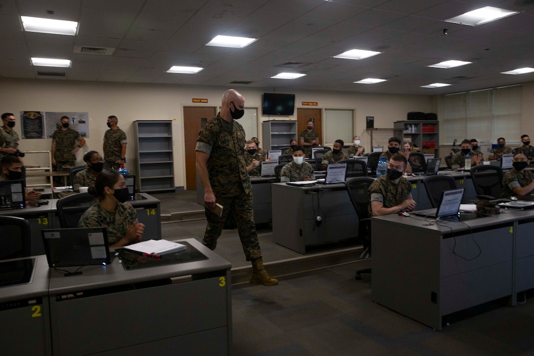 The 19th Sergeant Major of the Marine Corps, Sgt. Maj. Troy E. Black speaks to an intermediate level class at the Marine Corps Combat Service Support School (MCCSSS) at Marine Corps Base Camp Johnson, Jacksonville, N.C., Sept. 17, 2020. During the visit Sgt. Maj. Black discussed the importance of sustaining the transformation as Marines prepare to graduate from their entry level school. MCCSSS develops, conducts and evaluates formal training for entry, intermediate and advanced level officer, enlisted and civilian students in Personnel Administration, Ground Supply Support and Distribution, Financial Management and Logistics Operations, as well as Marine Corps Water Survival training. (U.S. Marine Corps photo by Sgt. Victoria Ross)