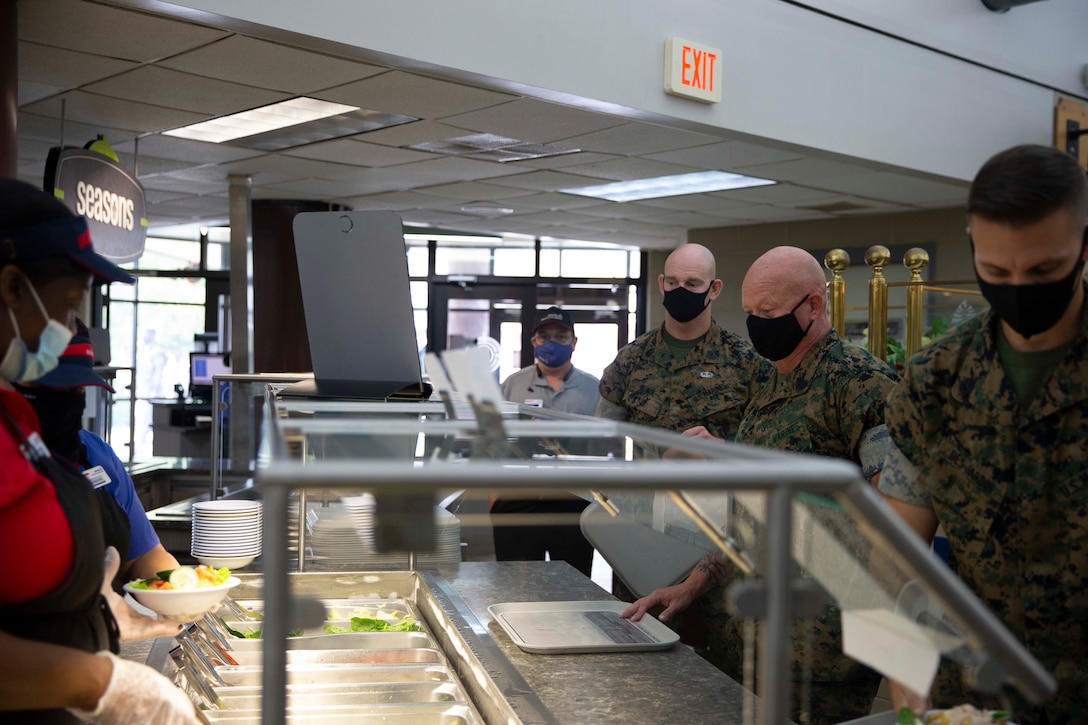 The 19th Sergeant Major of the Marine Corps, Sgt. Maj. Troy E. Black waits in line at the chow hall at Marine Corps Base Camp Johnson, Jacksonville, N.C., Sept. 17, 2020. During the lunch Sgt. Maj. Black discussed the importance of sustaining the transformation and addressed any questions MCCSSS instructors might have for him. MCCSSS develops, conducts and evaluates formal training for entry, intermediate and advanced level officer, enlisted and civilian students in Personnel Administration, Ground Supply Support and Distribution, Financial Management and Logistics Operations, as well as Marine Corps Water Survival training. (U.S. Marine Corps photo by Sgt. Victoria Ross)