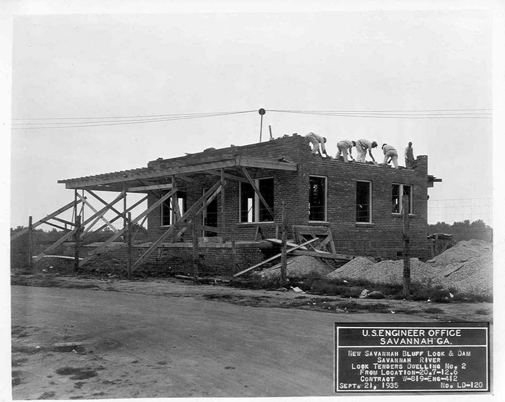 Workers built support buildings, such as these houses for the lock keepers, in addition to the lock and dam, 1935.