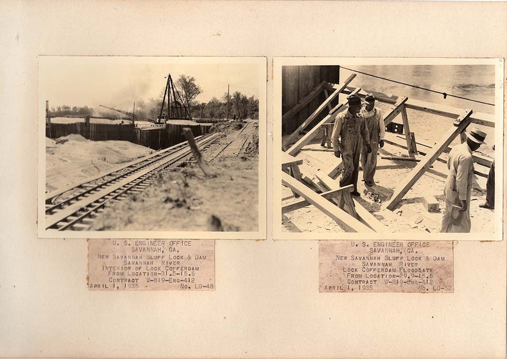 Workers walk along the top of the lock coffer dam in 1935.