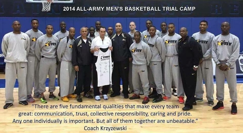 group of men standing on a basketball court.