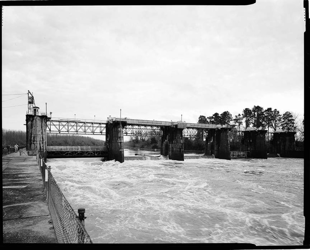 Overall view of dam from downstream outer lock wall, facing east, 2020.