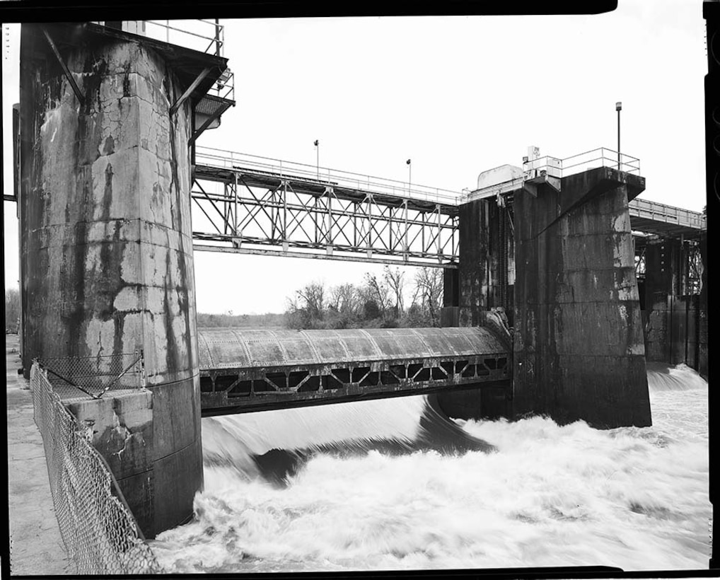 Overall view from downstream of operations building and gate 1 during high water, facing east, 2020.