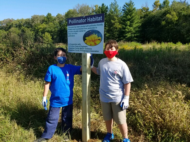 Cub Scouts from Pack 503 dig a hole for a new pollinator habitat sign at Cheatham Lake in Ashland City, Tennessee, Sept. 19, 2020 in support of National Public Lands Day. (USACE photo by Amber Jones)