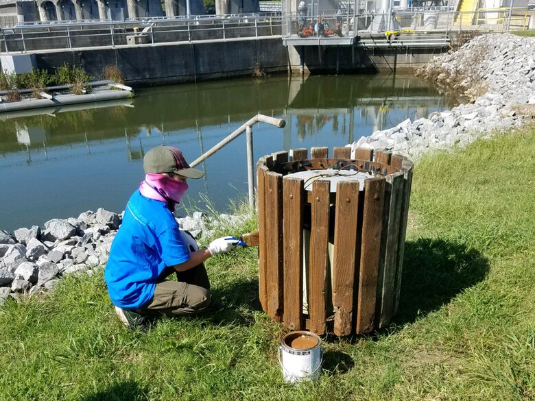 A Cub Scout from Pack 503 paints a trash receptacle at Cheatham Lake in Ashland City, Tennessee, Sept. 19, 2020 in support of National Public Lands Day. (USACE photo by Amber Jones)