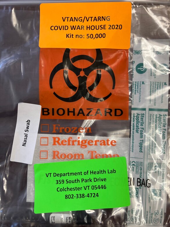 A COVID test kit packed in a bag with biohazard symbol on it.