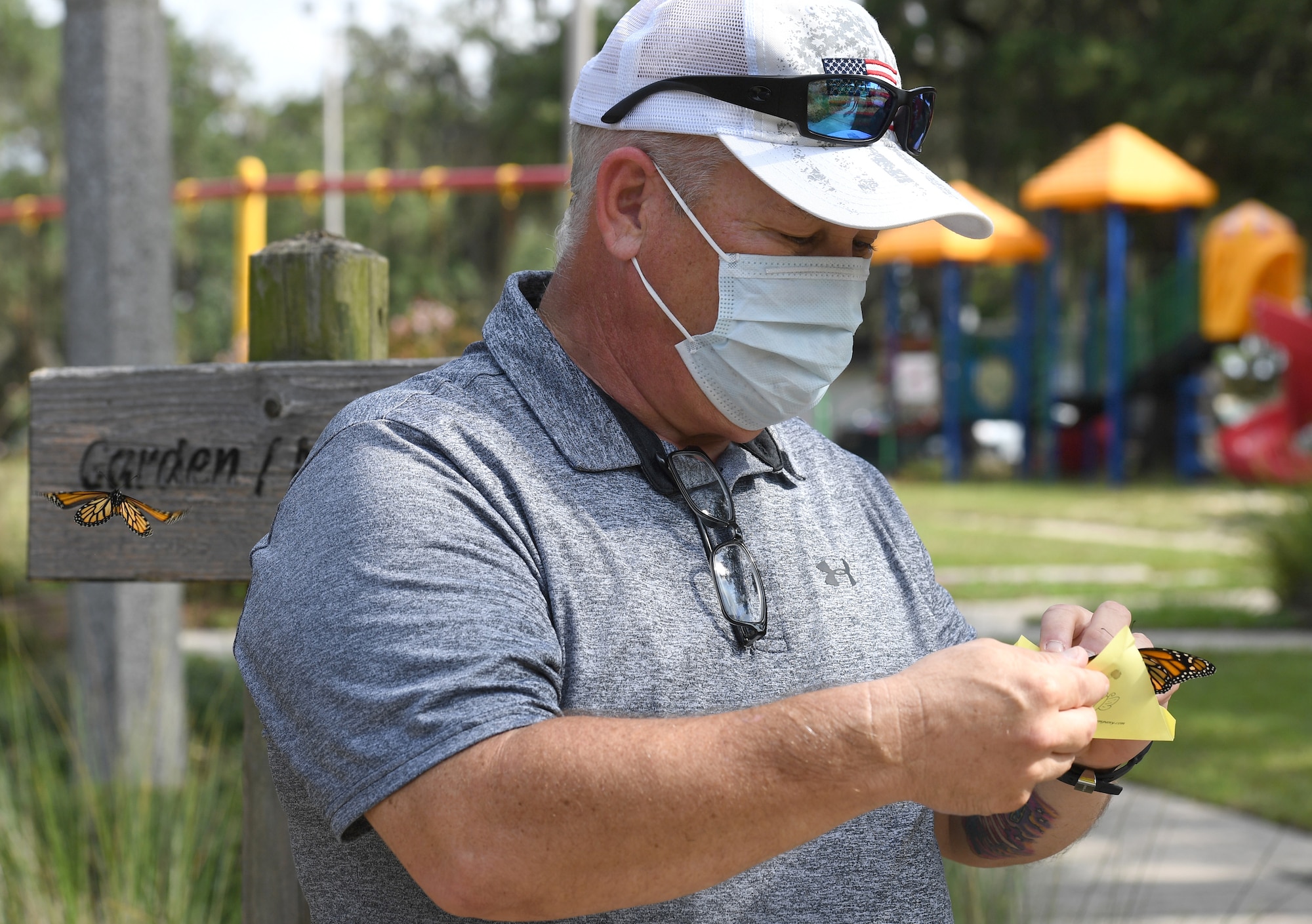 Mike Bradford releases a butterfly in memory of his son, U.S. Air Force Airman 1st Class Brian Bradford, during the Butterfly Release Ceremony honoring Keesler's Fallen Heroes at the Marina at Keesler Air Force Base, Mississippi, Sept. 25, 2020. Bradford was killed while deployed Dec. 6, 2018. The event was held in conclusion of Gold Star Family Remembrance Week, which honored the families of fallen service members. (U.S. Air Force photo by Kemberly Groue)