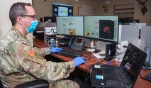 Arapahoe Task Force Emergency Operations Center Operations Planner U.S. Army Capt. Alexander Gibson performs plans and logistics operations at the Arapahoe county sheriffs emergency operations center, Centennial, Colo., 8 April, 2020. Members of the Colorado National Guard volunteer to support state and local officials combat the Corona Virus Pandemic by assisting state and local emergency operations centers state wide, setting up a joint operations center and preparing shelters for those without homes in the Denver area. (U.S. Air National Guard photo by Senior Master Sgt. John Rohrer)