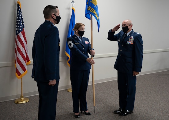 Photo of Airman standing behind podium