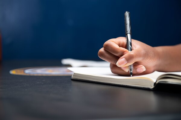 Lt. j.g. Cleopatra Haynes, from Jacksonville, Fla., assigned to the guided-missile cruiser USS Princeton (CG 59), prepares a poem for a poetry slam on the ship’s mess decks.