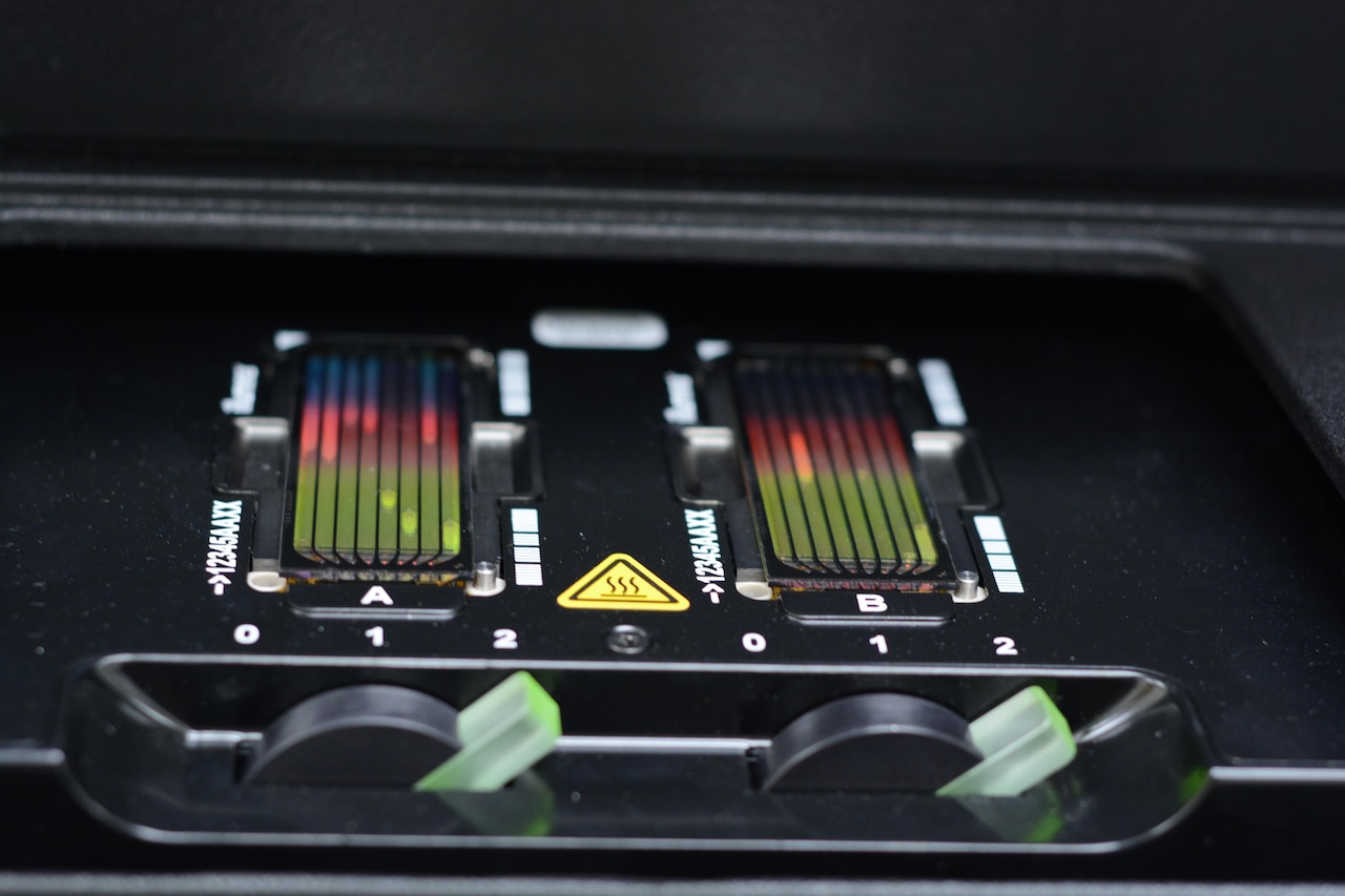 Next-generation sequencing flowcells are displayed on a medical device.