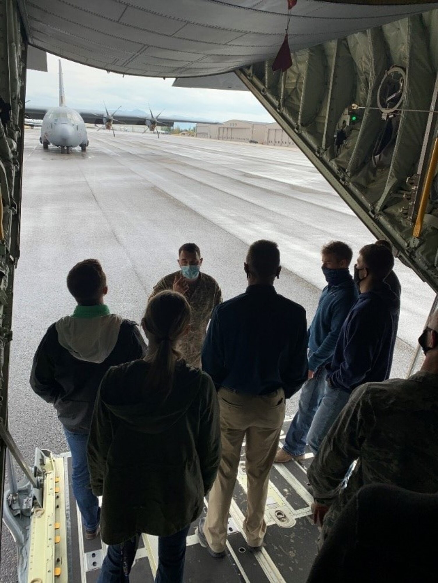 A group of people gather for a tour