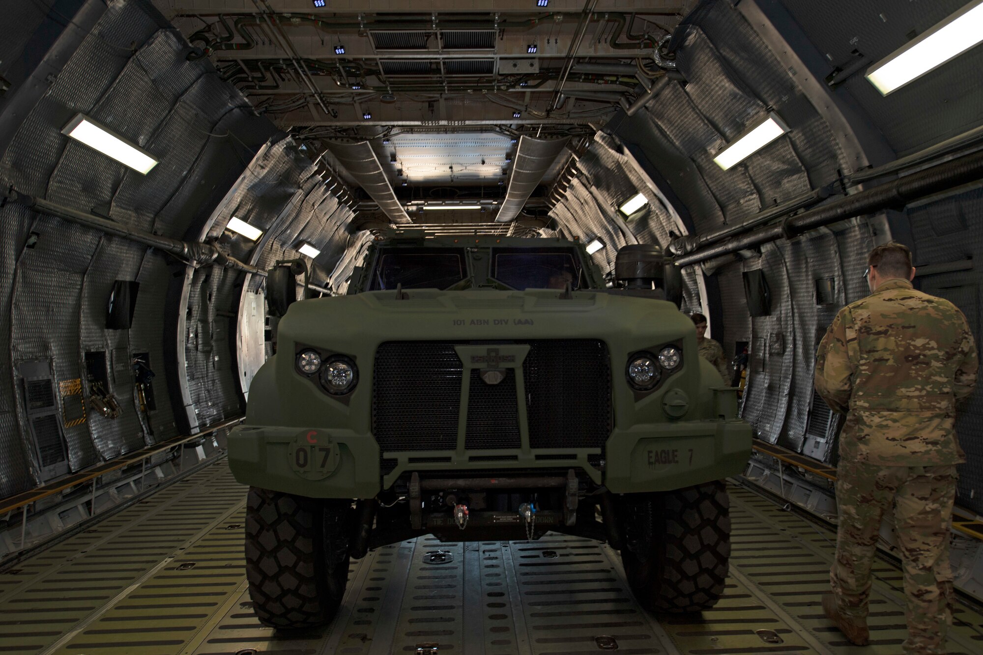 U.S. Airmen and Soldiers train together to load a Chinook-47 into a C-5M Super Galaxy