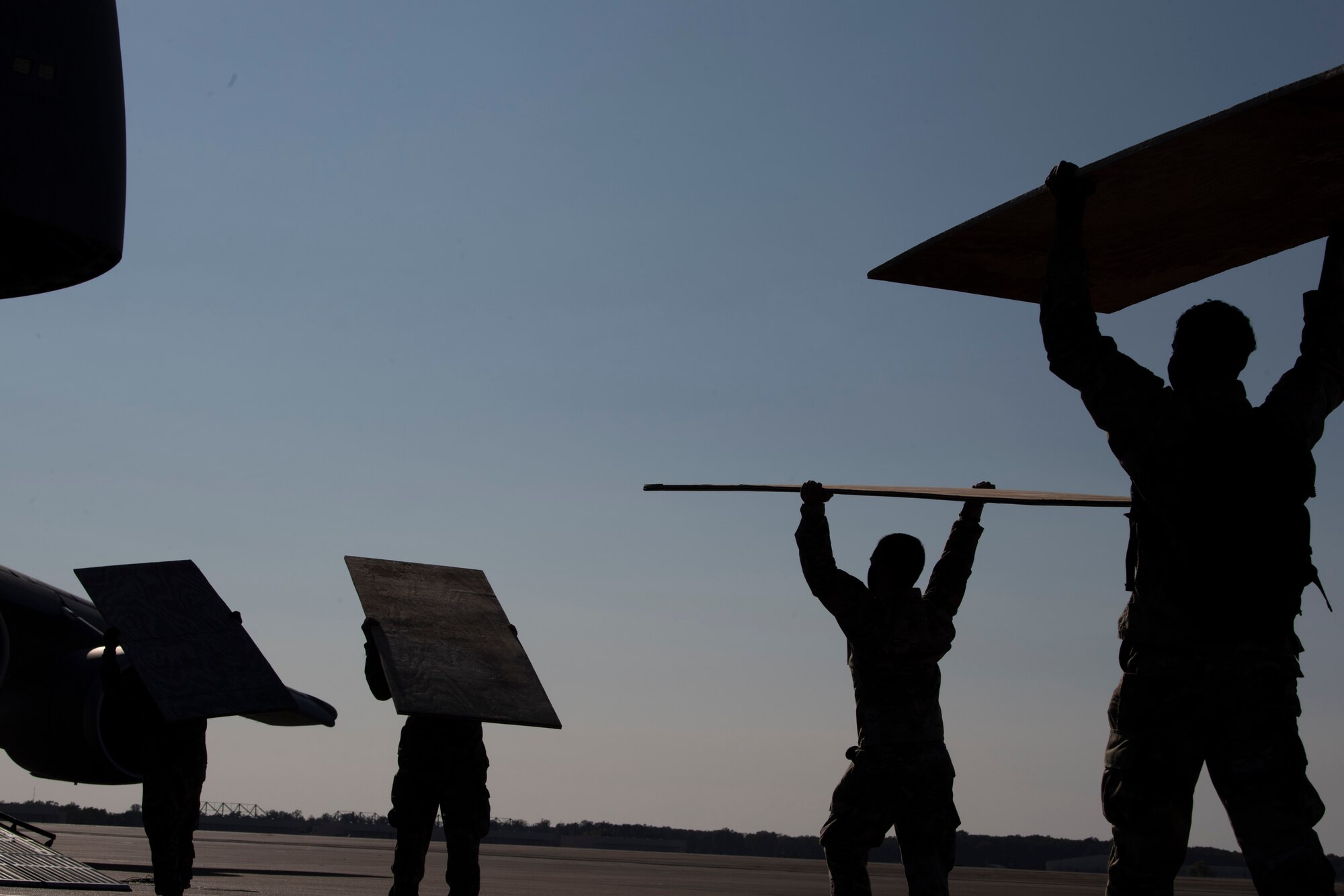 U.S. Airmen and Soldiers train together to load a Chinook-47 into a C-5M Super Galaxy