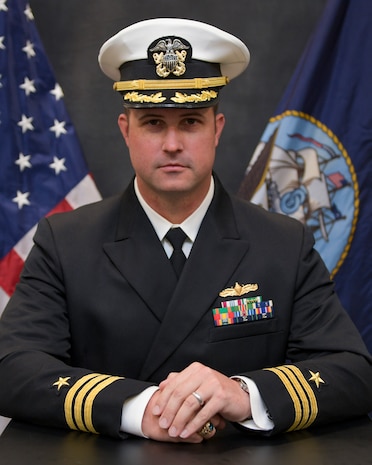 Cmdr. Jim Welsch, executive officer of the Arleigh Burke-class guided-missile destroyer USS Cole (DDG 67), poses for a studio portrait.