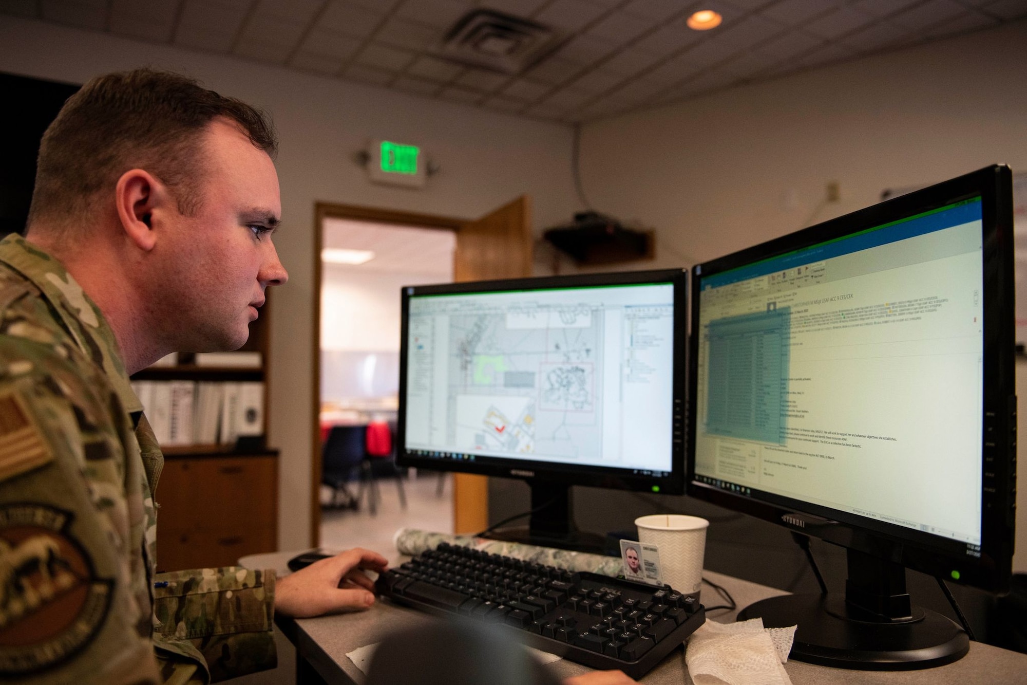 Tech. Sgt. Kevin Cuningham,  9th Civil Engineer Squadron noncommissioned officer in charge of execution support, works with a map and data on Beale Air Force Base.
